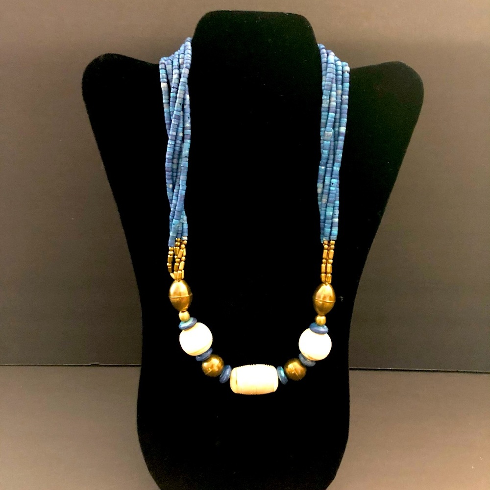 Eye catching beaded necklace. Bronze, blue and ivory color beads. 24 inches.
